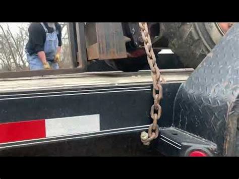 how to tie down a skid steer on trailer|how to chain a skid steer.